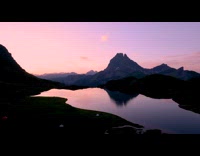 Reflection of mountain and sunrise on lake
