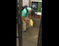 blue shirt yellow bag falls asleep standing up