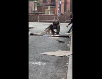 Woman in dirty white dress video shoot at the street