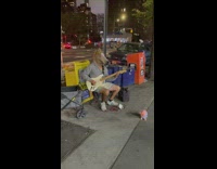 Guy wearing horse masks plays electric guitar 