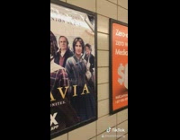 Ladys face cut out of belgravia poster 