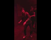 Guy falls after punching punching bag machine