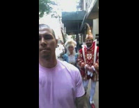 Guy walks between couple wearing medieval costumes 