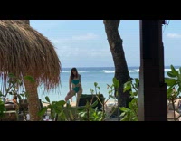 Collab IITW - Woman green bikini poses front of sunbed