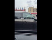 Guy play drum sticks on steering wheel