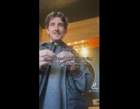 Guy standing over girl using toilet 