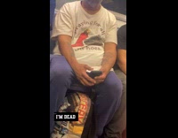 Man wear funny shirt print  in train