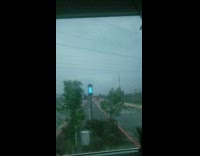 Guy records rainstorm gets scared lightning bolt 