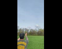 Guy hits tums with slingshot midair 