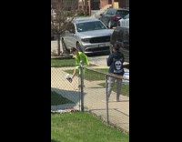 Kid bounces toilet paper with feet 
