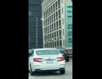 Two car driver with feet outside window