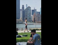 Man carry woman on shoulder walk at park