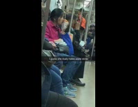 Woman pink jacket eats apple and spits out skin on subway train