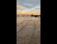 Small red car goes up a small poorly made ramp