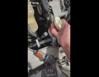 Guy uses deodorant on car belt 