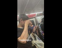 Guy shaves tips of his hair with a razor and mirror on the subway train 
