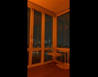 Lightning storm view of nyc skyline corner apartment