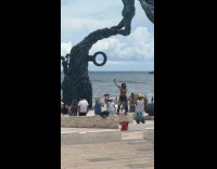 Woman dances near the tribal beach ritual