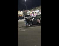 Girl jump poses in middle of parking lot