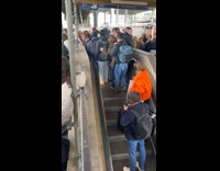 People crowded at the end of escalator