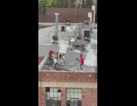 Rappers with two girls dance on rooftop
