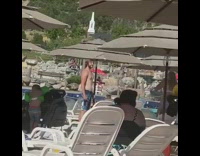 Man shirtless pictorial by girlfriend public beach