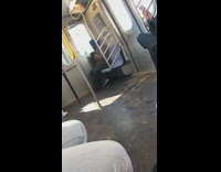 Collab Subway Creatures - Man lights up a cigarette inside subway train