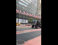 Collab WINY - Grey van tall wheel suspension drive on street