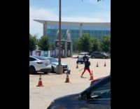 Man films with baseball bat at parking lot