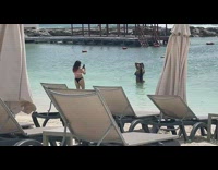 Woman Violet Bikini Kneels at the beach shore Part 2