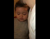 Little boy fake sad evil smirk