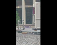 Delivery packages being thrown out the back of a truck 