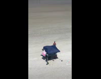 Shirtless man stretch then run towards ocean