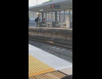 Girl sits train station bench music video 
