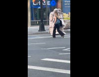 Strange man costume cross down the street