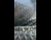 Guy on blue motorcycle does wheelie falls