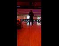 Man bowling throws ball to other alley