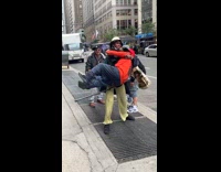 Collab Subway Creatures - Woman lifts and carry man on sidewalk