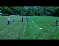 Family launching rocket on field 