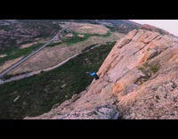 Guy almost runs into mountain blue parachute 