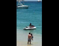 Collab IITW - Woman in black bikini rides and poses at the jet ski