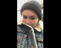 Man wears same denim jacket fur collar as girl on subway train