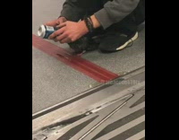 Man feeds pigeon bird energy drink out of can on subway train