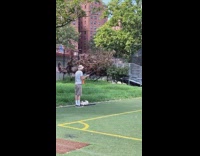 Guy casts fishing rod pole baseball field 