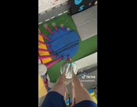 Man Walks Up Steep Pole at Gymnasium