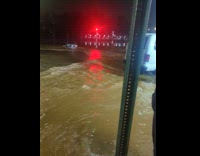 Filmer show flood water on street night