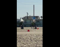 Three people Rollerblade video shoot beach park