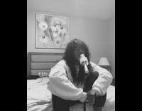 Girl sings in bedroom 