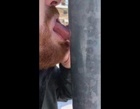 Man sticks tongue to the metal pole