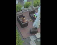 Woman in bikini poses while kid takes her picture